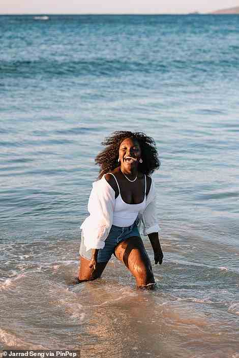 Esther Onek, social worker, advocate and refugee, is photographed here by Seng wading through the sea
