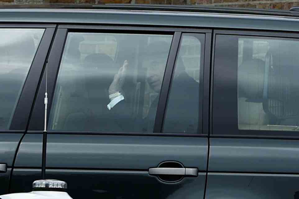 Prince Andrew waved at photographers as he and the Queen returned to Windsor Castle this afternoon following a Westminster Abbey service celebrating Prince Philip