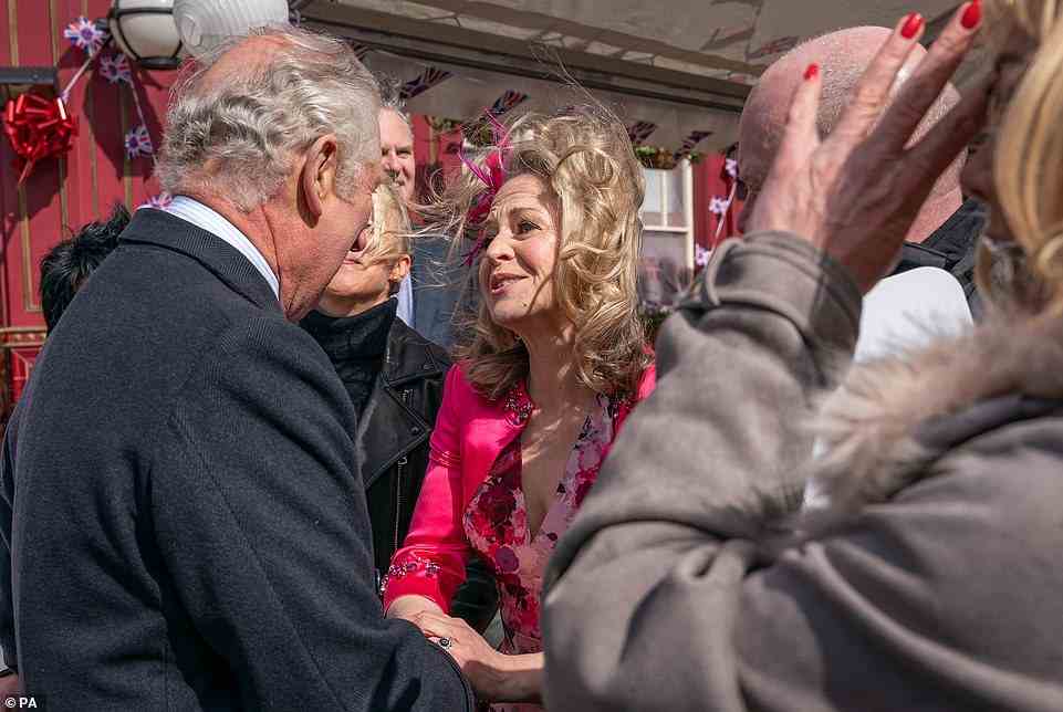 A gust of wind ruffled Kellie Bright's hair as she gave Charles a very warm welcome to the set of the show