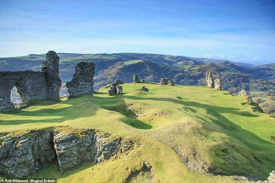 CASTELL DINAS BRAN, LLANGOLLEN, WALES: 'Towering over the town of Llangollen, the atmospheric ruins of Castell Dinas Bran stand atop its dramatic fairy-haunted hill,' writes Wildwood. 'The medieval castle was built on the site of an earlier Iron Age fort that some believe was a stronghold of the legendary hero Bran the Blessed, although in Arthurian lore, this location is a strong contender for the Fisher King’s Grail Castle. One early version of the Grail legend names the Fisher King as Bron and the castle corbin, an old French term for raven, which is also the meaning of the name Bran.' Coordinates: 52.9793, -3.1589
