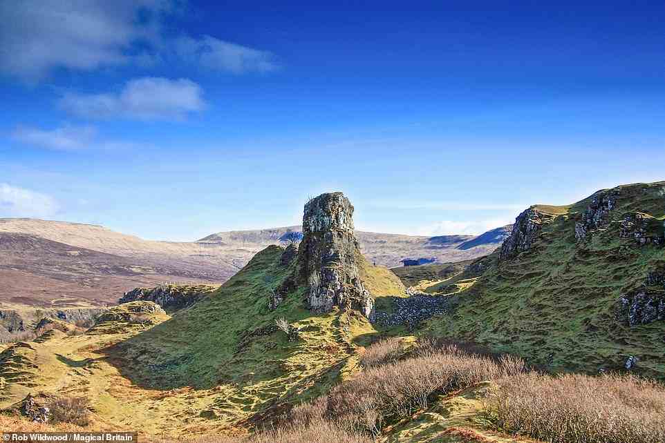 FAIRY GLEN, UIG, ISLE OF SKYE: This 'otherworldly landscape of strange rock formations and ancient forests of hazel has become known as the Fairy Glen', the book reveals, adding: 'At its centre stands a huge flat-topped column of rock called Castle Ewen that some believe is a fairy dwelling. People push coins into cracks in a cave below it so the fairies will grant their wishes. All around this tower of rock people have made stone sculptures including spirals and labyrinths where rituals are sometimes performed.' Coordinates: 57.5827, -6.3257