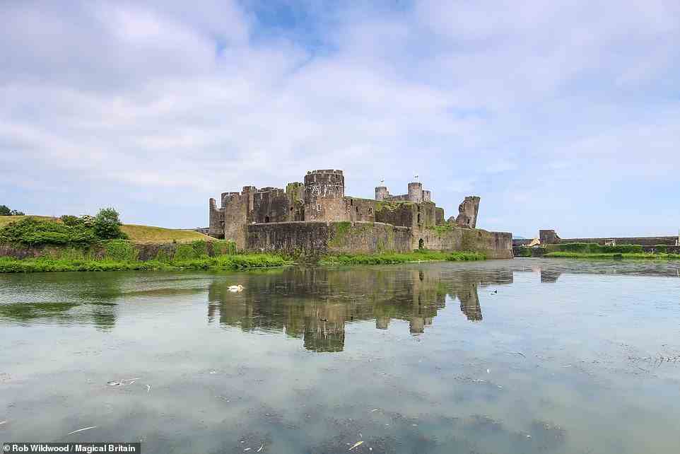 CAERPHILLY CASTLE, WALES: There have been some strange sights spotted in Caerphilly, the largest castle in Wales, the book reports. 'Legend tells of a lady dressed all in green who was sometimes seen gliding along the ramparts,' it reveals. The castle moat, it says, was haunted by another supernatural being known as the Gwrach-y-Rhibyn, an 'unearthly hag with bat-like wings, long black hair and talons for fingers who could be heard wailing and groaning like a banshee'.  Coordinates: 51.576065, -3.220298