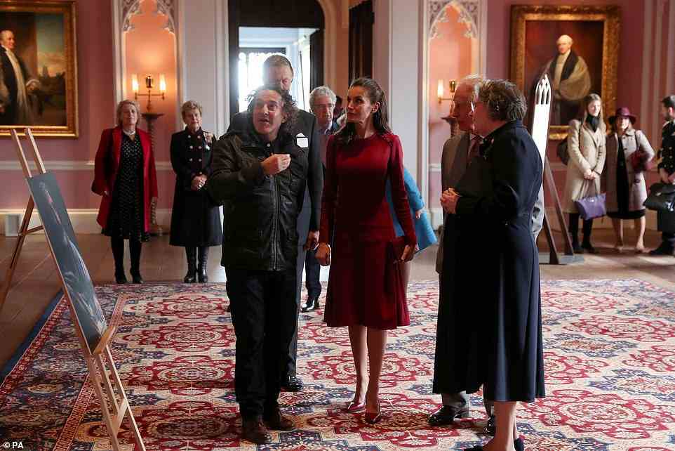 The two royals could be seen chatting to members of staff as they were offered a tour of the castle this afternoon (pictured)