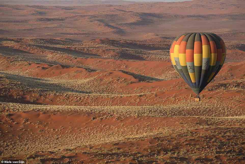 Describing her hot air balloon trip with the family-run company Namib Sky, Kate says: 'We drift above an archipelago of granite inselbergs (isolated mountains), and thousands of circles, like giant necklaces in the sand'