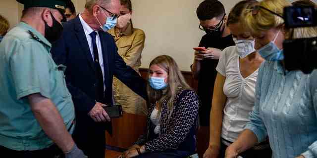 Alina Tsybulnik (C), girlfriend of US ex-marine Trevor Reed, charged with attacking police, reacts during verdict hearing at Moscow's Golovinsky district court on July 30, 2020. 