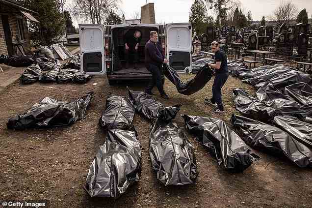 Ukraine and Russia are in the midst of a horrific war which has seen more than 24,000 deaths. Cemetery workers are pictured unloading bodies of civilians killed around Bucha on April 7