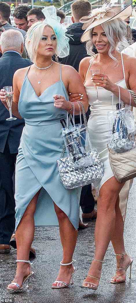 These women coordinated, opting for similar satin dresses in complemetary shades of blue and white