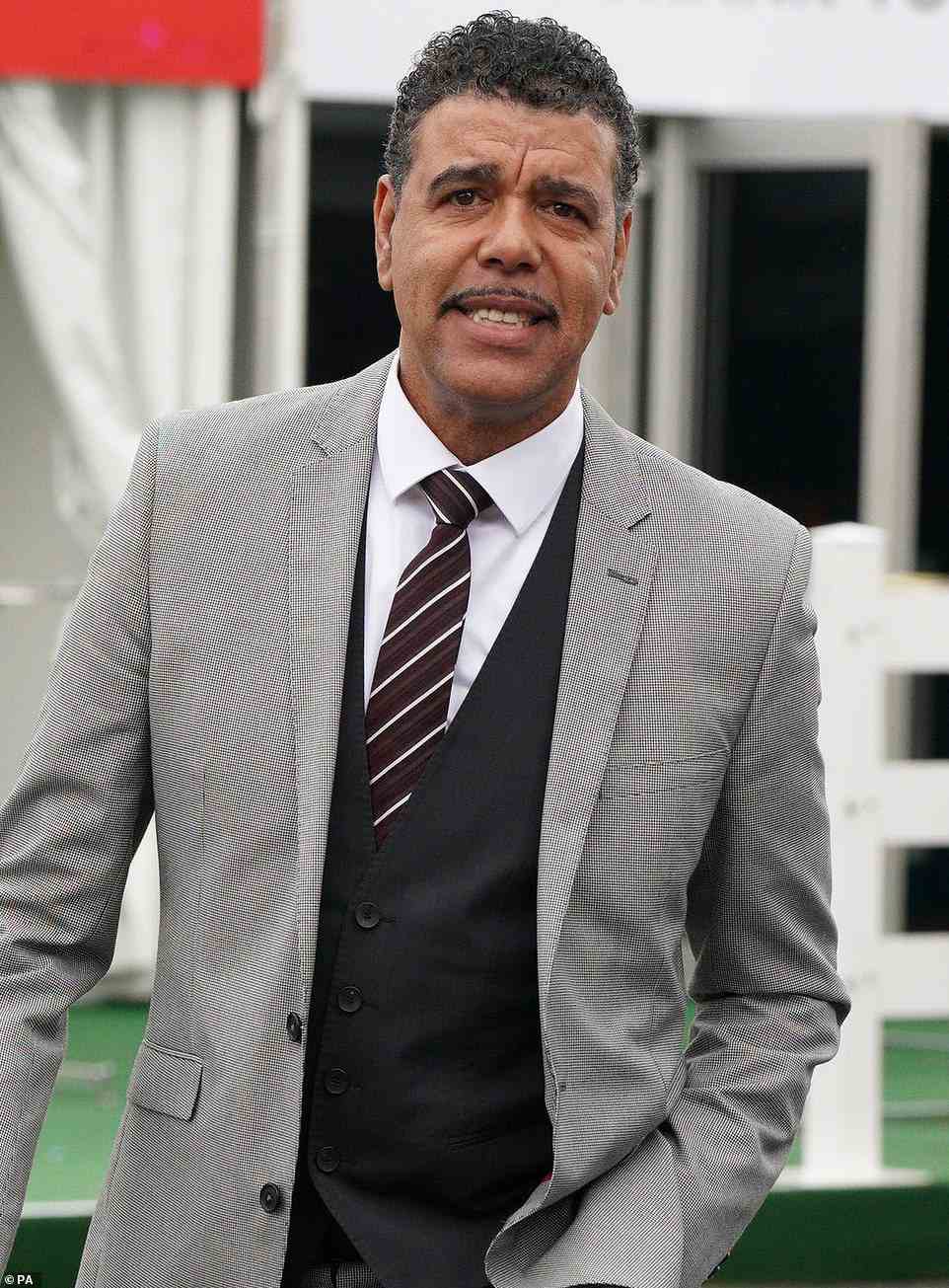 Chris Kamara (pictured) also dressed more appropriately for the weather, adding a waistcoat for an extra layer underneath his blazer