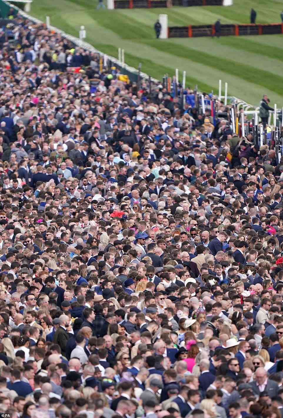 Racegoers react as they anxiously watch the EFT Construction Handicap Hurdle during Grand National Day of Ainstree 2022