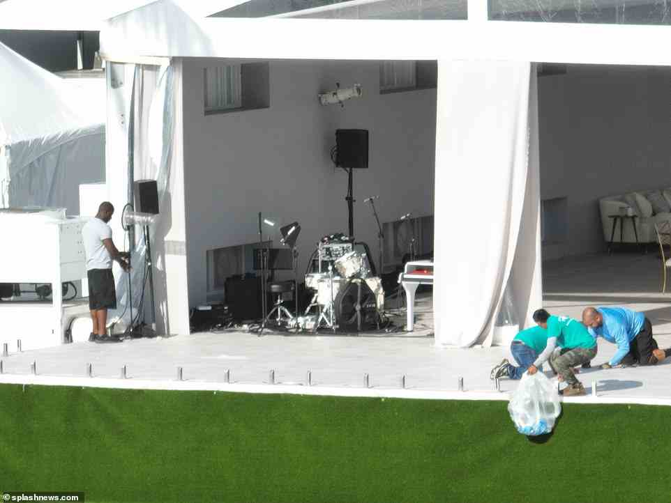 Set up: Grey drapes were hanging from the sides of the marquee with open sections looking out onto the nearby beach so guests will be able to look at the views and take steps down to the sand, while speakers and a drum set were set up in the corner ready for dancing