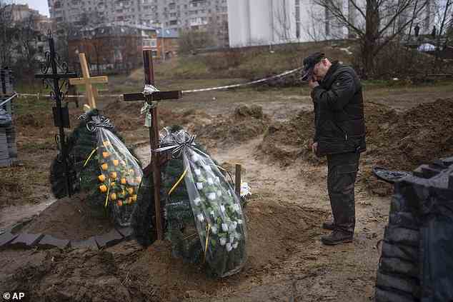 Oleg, 56, mourns for his mother Inna, 86, killed during the war against Russia in Bucha, in the outskirts of Kyiv, Ukraine, on Sunday