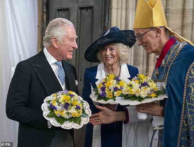 The Prince of Wales and the Duchess of Cornwall are greeted by the Bishop of Worcester as they represent the Queen, at the Royal Maundy Service at St George's Chapel, Windsor