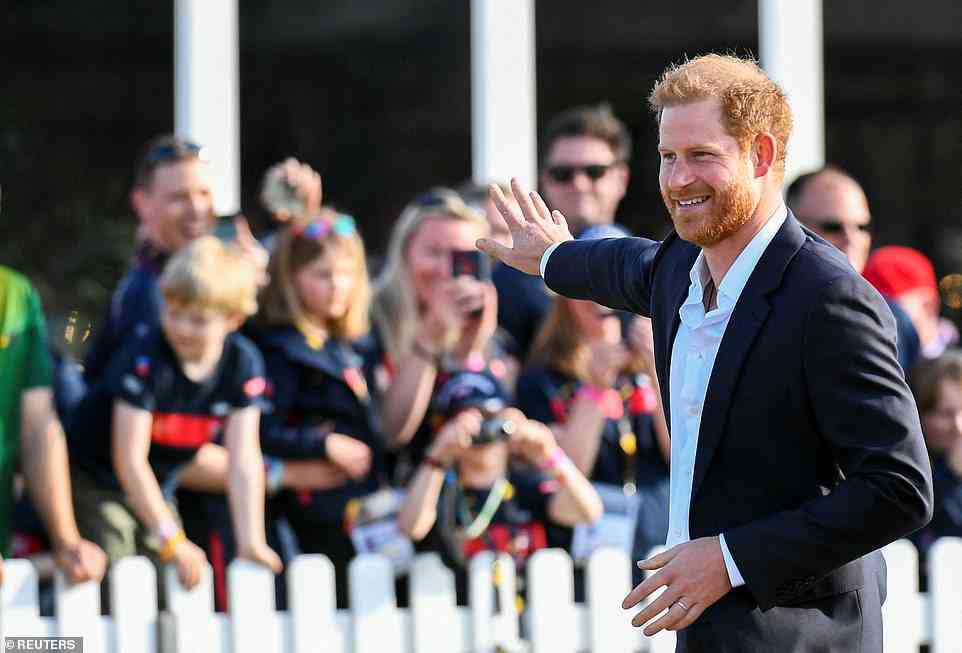 Harry was seen smiling broadly and waving as he walked to the reception tent to meet dignitaries and athletes at the event