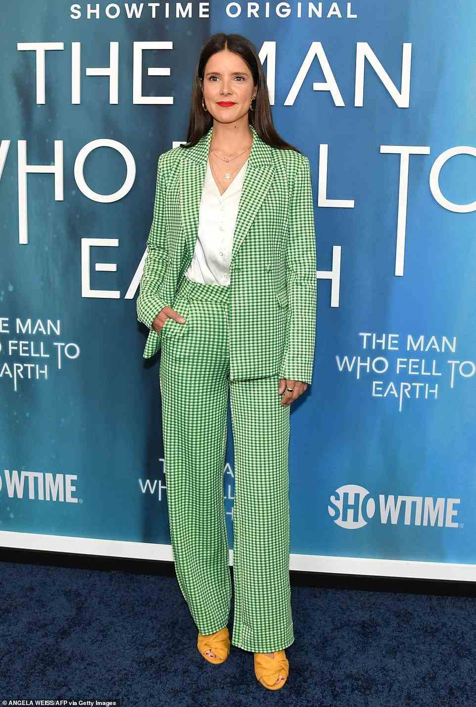 Menswear: British beauty Sonya Cassidy - who plays Edie Flood - pulled off a daring green gingham pantsuit with yellow peep-toe heels and a bright red pout