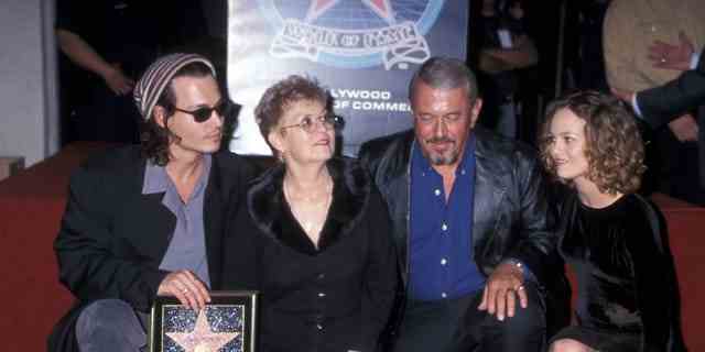 Actor Johnny Depp, mother Betty Sue Wells, father John Depp and girlfriend Vanessa Paradis in 1999. While on the stand, Depp recalled his life as an adolescent.