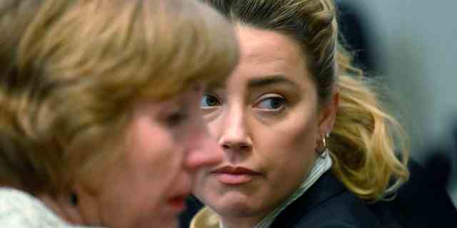 Attorney Elaine Bredehoft, left, and actress Amber Heard look on during a trial in the Fairfax County Circuit Courthouse in Fairfax, Virginia, on April 19, 2022. After Paradis and Depp split in 2012, the star started dating Heard. By Christmas Eve 2013, they were engaged, and in 2015, they were saying their "I Dos."