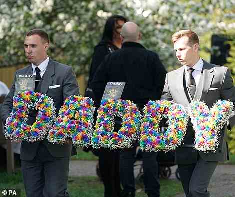 Father: Multi-coloured flowers shaped to read the word "daddy", with photographs of handprints from his children, Bodhi, one and Aurelia, two, were carried into the church service after adorning the carriage