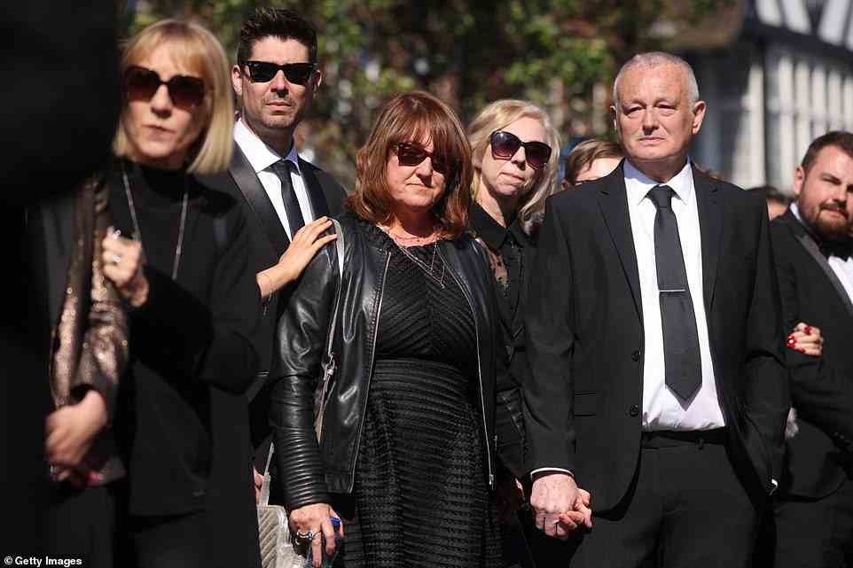 Family: Tom's parents Noreen and Nigel Parker were seen holding hands as they stood alongside Kelsey and her mum and dad
