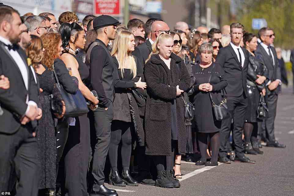 With the fans: Max was pictured standing among fans and friends of the star on the funeral route