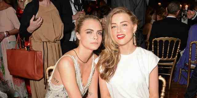 Heard is currently dating girlfriend Bianca Butti. She's also been tied to Cara Delevingne, pictured here.