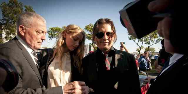 Amber Heard, and Johnny Depp leave Southport Magistrates Court, Queensland, April 18, 2016. At the time, Heard received a fine for bringing pet dogs, Pistol and Boo, illegally into Australia in 2015. Now, Depp and Heard are locked into a court battle of their own against each other.