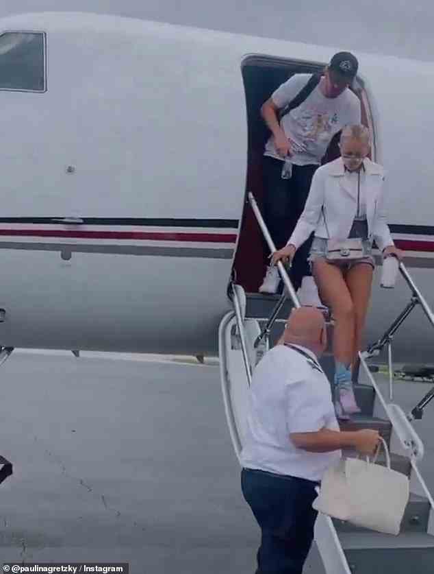 Paulina also shared footage of herself stepping off the plane after they landed, which was set to the song 'Going To The Chapel'