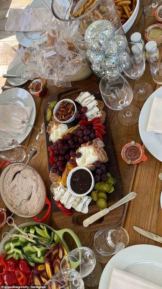 Paulina and her guests were treated to a charcuterie plate, vegetables with dip, bread, and other snacks along with their meal