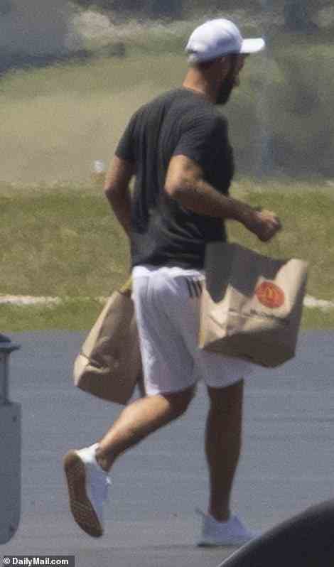 Dustin Johnson, 37, was spotted carrying bags of McDonald's as he boarded the private jet Sunday