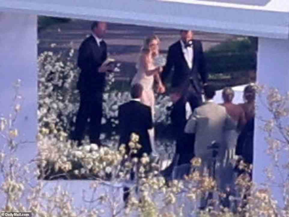 Paulina Gretzky and Dustin Johnson are seen at their wedding ceremony on Saturday