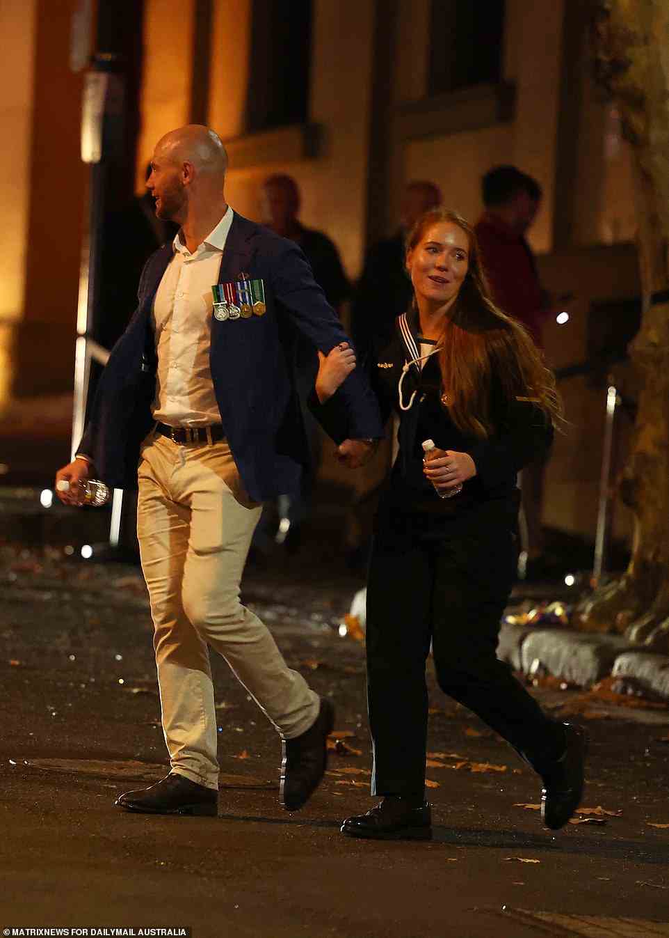 Two military personnel appeared to opt for water as the exited a venue in the Sydney CBD on Monday