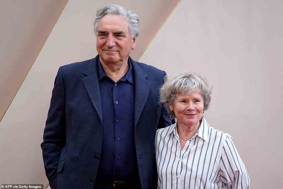 Chic: Imelda styled her grey tresses in a curled style as she posed with her arm wrapped around her husband of almost 40 years