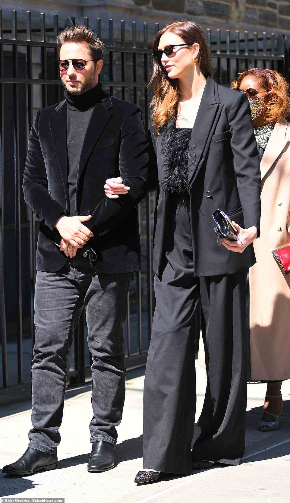 Karlie Kloss was spotted entering the memorial with longtime friend and journalist Derek Blasberg. She donned black flowing pants, a feathered black top and a matching blazer. She also wore dark sunglasses as she walked into the Harlem church