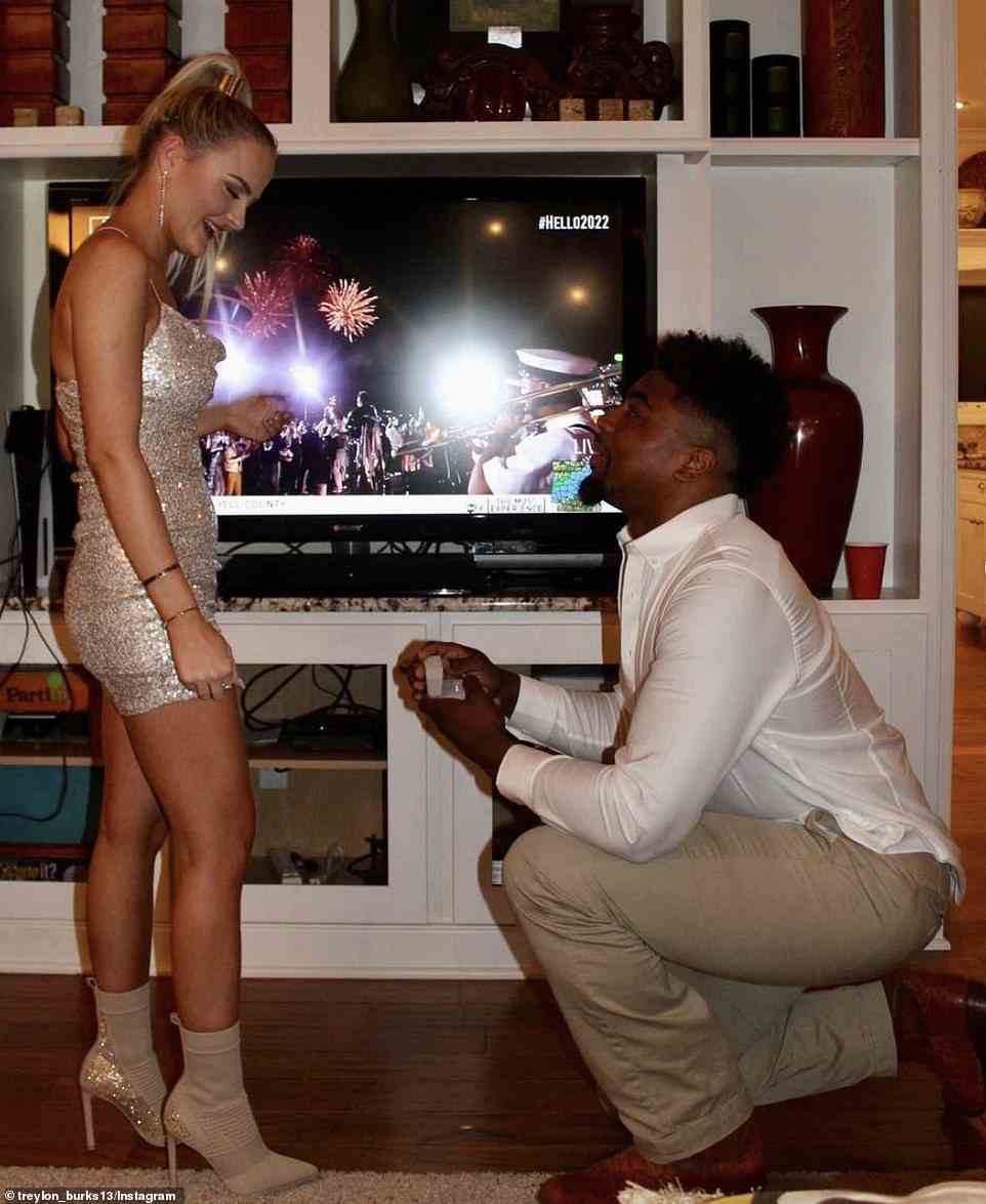 'Ringing in the new year with my fiancé @treylon_burks13 I love you endlessly & I can’t wait to be your wife,' she wrote - including a photo of the moment he got down on one knee to pop the question at midnight