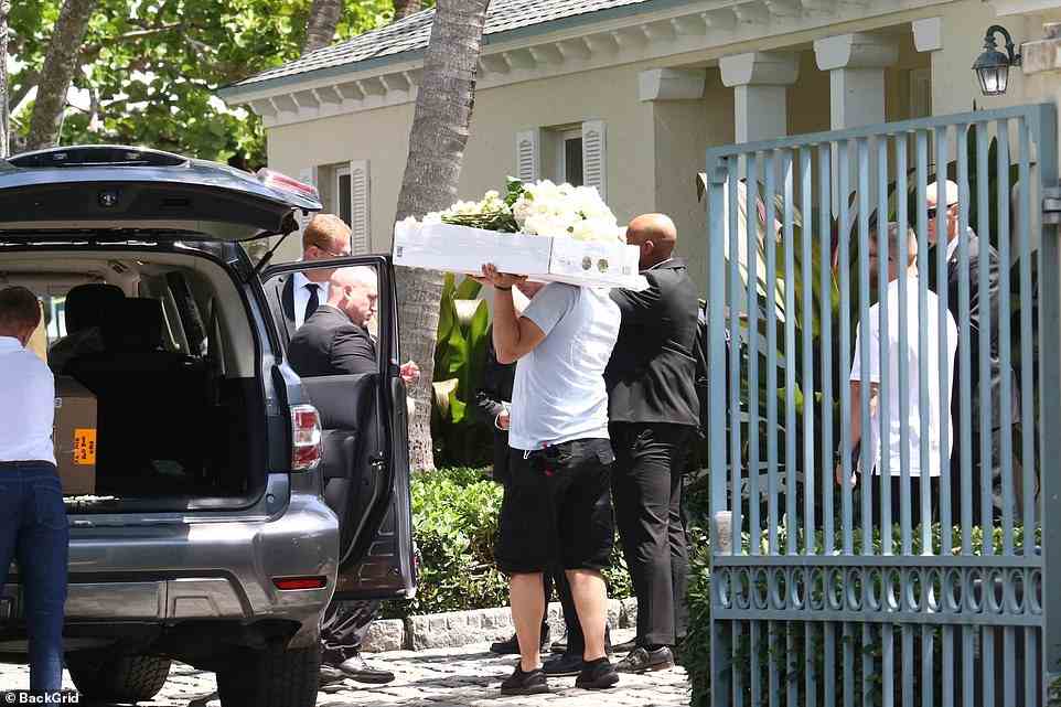 Big day: White floral arrangements were delivered ahead of Brooklyn Beckham and Nicola Peltz 's extravagant $3.9million Palm Beach wedding as finishing touches were being made at the Peltz family estate on Saturday morning