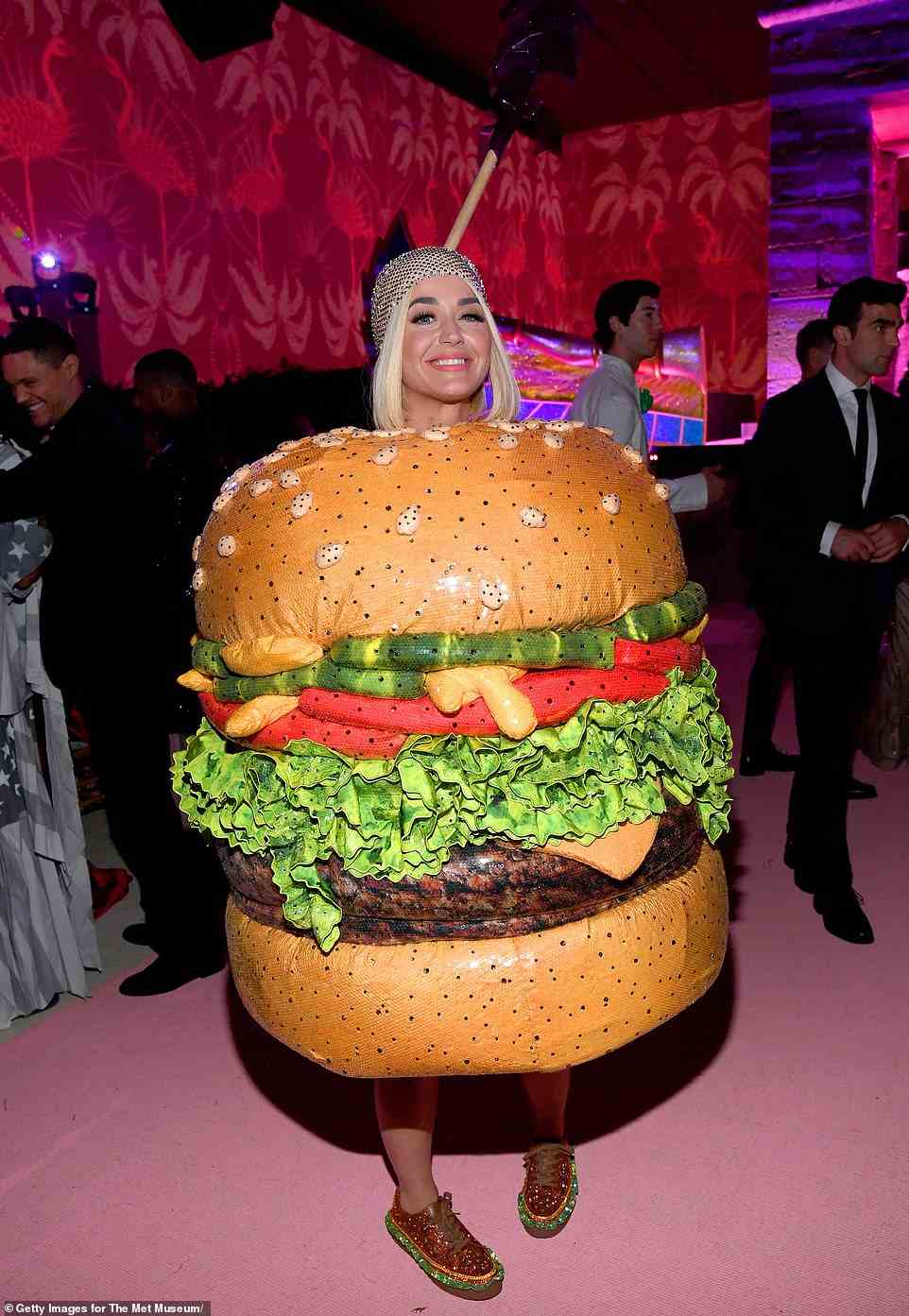 Katy clearly couldn't get enough of the theme, and changed into this hamburger costume - and matching shoes - at the party