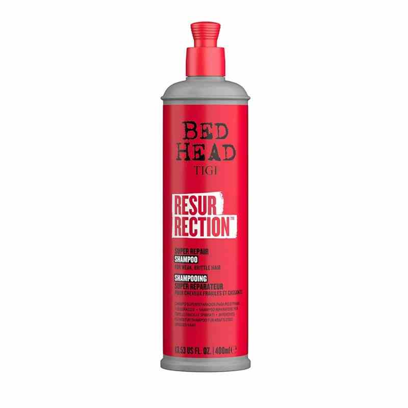 A red bottle of the Bed Head Resurrection Super Repair Shampoo on a white background