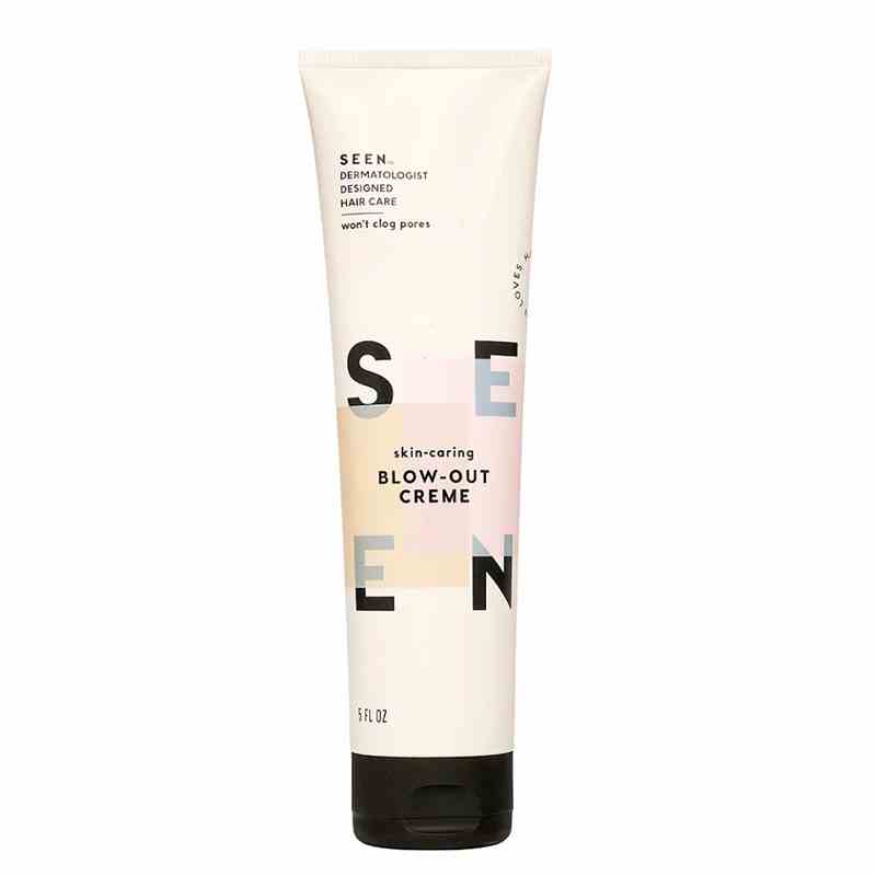 A white and light pink bottle of the Seen Blow-Out Creme on a white background