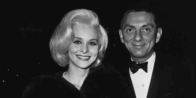 American film and television producer Aaron Spelling (1923 - 2006) with actress Diane McBain at a party for the film 'The Greatest Story Ever Told', 1965. 