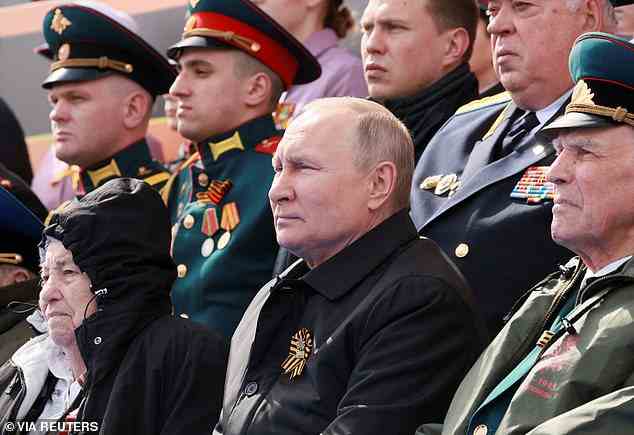 Russian President Vladimir Putin watches a military parade on Victory Day, which marks the 77th anniversary of the victory over Nazi Germany in World War Two, in Red Square in central Moscow, Russia May 9, 2022