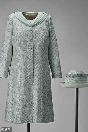 A further exhibition at the Palace of Holyroodhouse in Edinburgh will feature outfits worn by the Queen during her Silver, Golden and Diamond Jubilee celebrations, including this pale turquoise dress and coat, which is being exhibited for the first time