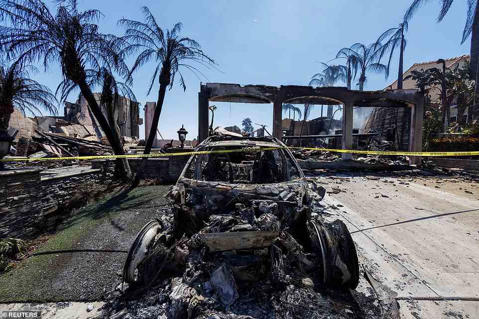 The remains of a Porsche and the devastating effects of the Coastal Fire. Another resident said that his Tesla was destroyed in the blaze