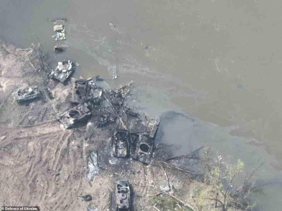The remains of at least three Russian tanks and another four armoured infantry vehicles are seen on one bank of the river, along with other pieces of wreckage poking out from under the water