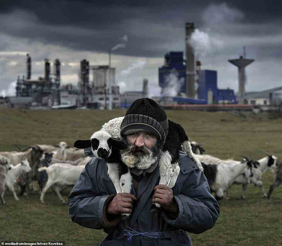Hungarian photographer Istvan Kerekes took the third and final spot in the people category with his image 'Alexandru', showing a farmer with a lamb over his shoulders, taken in Targu Mures in Romania (pictured)