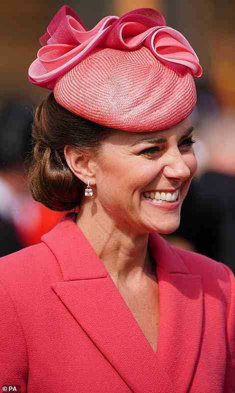 Pink perfection! Displaying her love of colour blocking, Kate wore her coral coat dress with a hat in the same shade