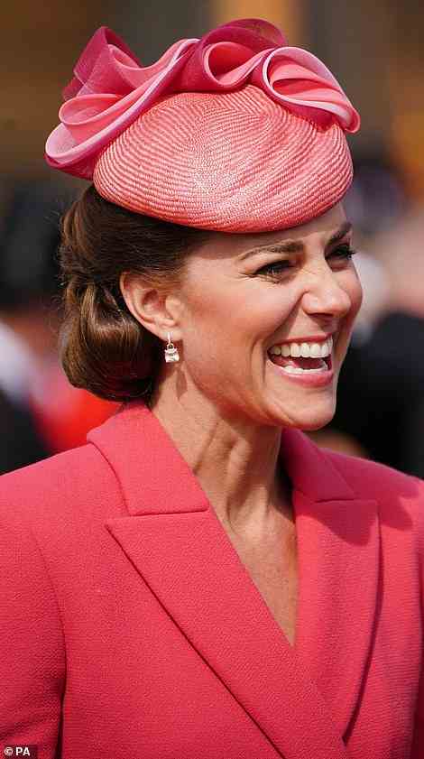 Plenty to smile about! The Duchess of Cambridge looked animated as she spent time speaking to guests in the garden