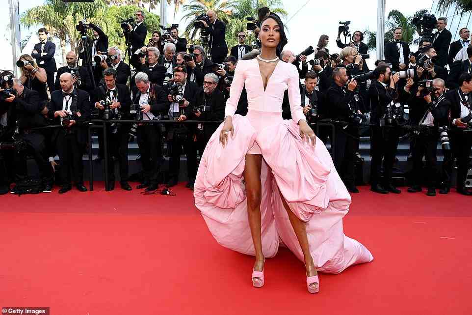 Dazzling: She elevated her already impressive height in a pair of bright pink high heels and added a diamond necklace and coordinating earrings for a touch of sparkle
