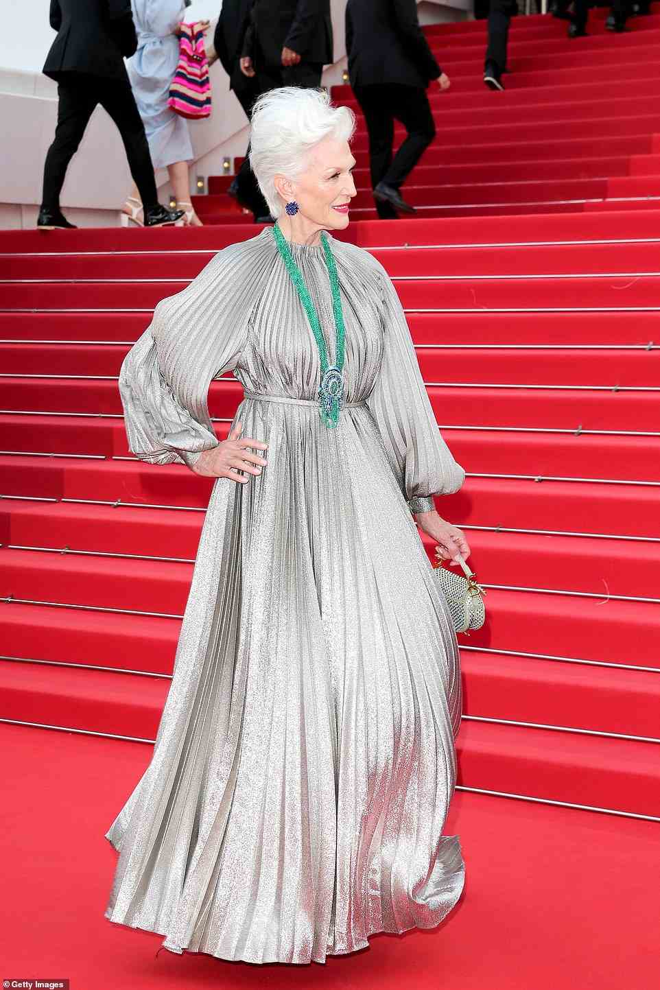 Classy: Maye Musk looked like the epitome of elegance in a pale grey silk gown with a belt to cinch her in at her svelte waist