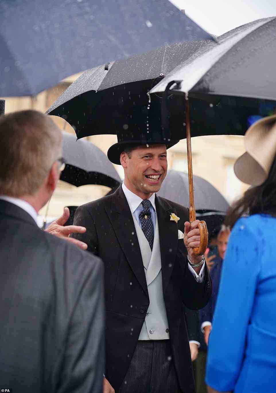 The Duke of Cambridge shared a smile with a group of attendees as they chatted at the garden party at Buckingham Palace