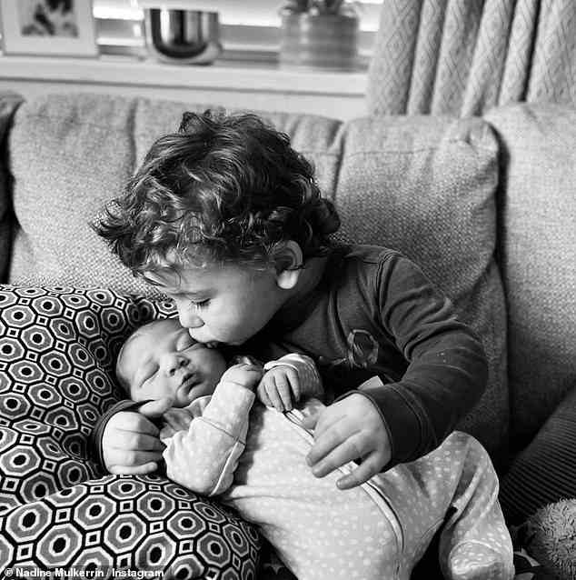 Brüder: Beide teilten eine Reihe entzückender Schwarz-Weiß-Schnappschüsse auf ihren jeweiligen Instagram-Seiten, die ihren ältesten Sohn Reggie, drei, zeigen, wie er seinen Bruder kuschelt