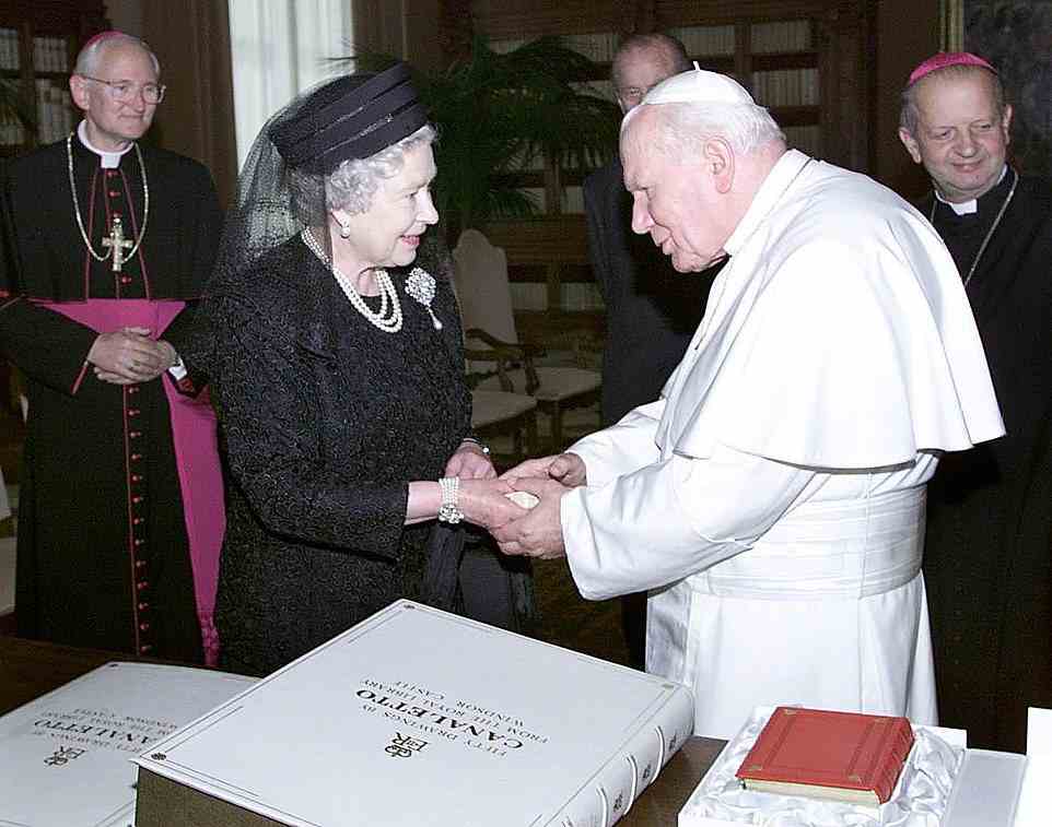 The Queen exchanges presents with Pope John Paul II during an audience at the Vatican in Rome on Tuesday, October 17, 2000. Dressed in black and wearing a veil, the Queen was greeted by the 80-year-old leader of the Roman Catholic Church at the door of his study. During a private meeting lasting 20 minutes, they are thought to have discussed progress towards Christian unity and the troubles in Northern Ireland